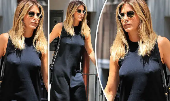 JENNIFER ANISTON goes braless and accidentally showed off her nipples in the process of wearing clothes